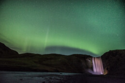 Sk&oacute;gafoss waterfall aurora borealis