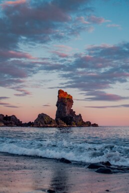 A rock formation at Dj&uacute;pal&oacute;nssandur black sand beach in West Iceland