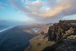 A man looks over the landscape from Dyrh&oacute;laey