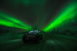 driving through northern lights in Iceland